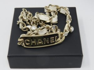Chanel: a White Logo Tag Choker